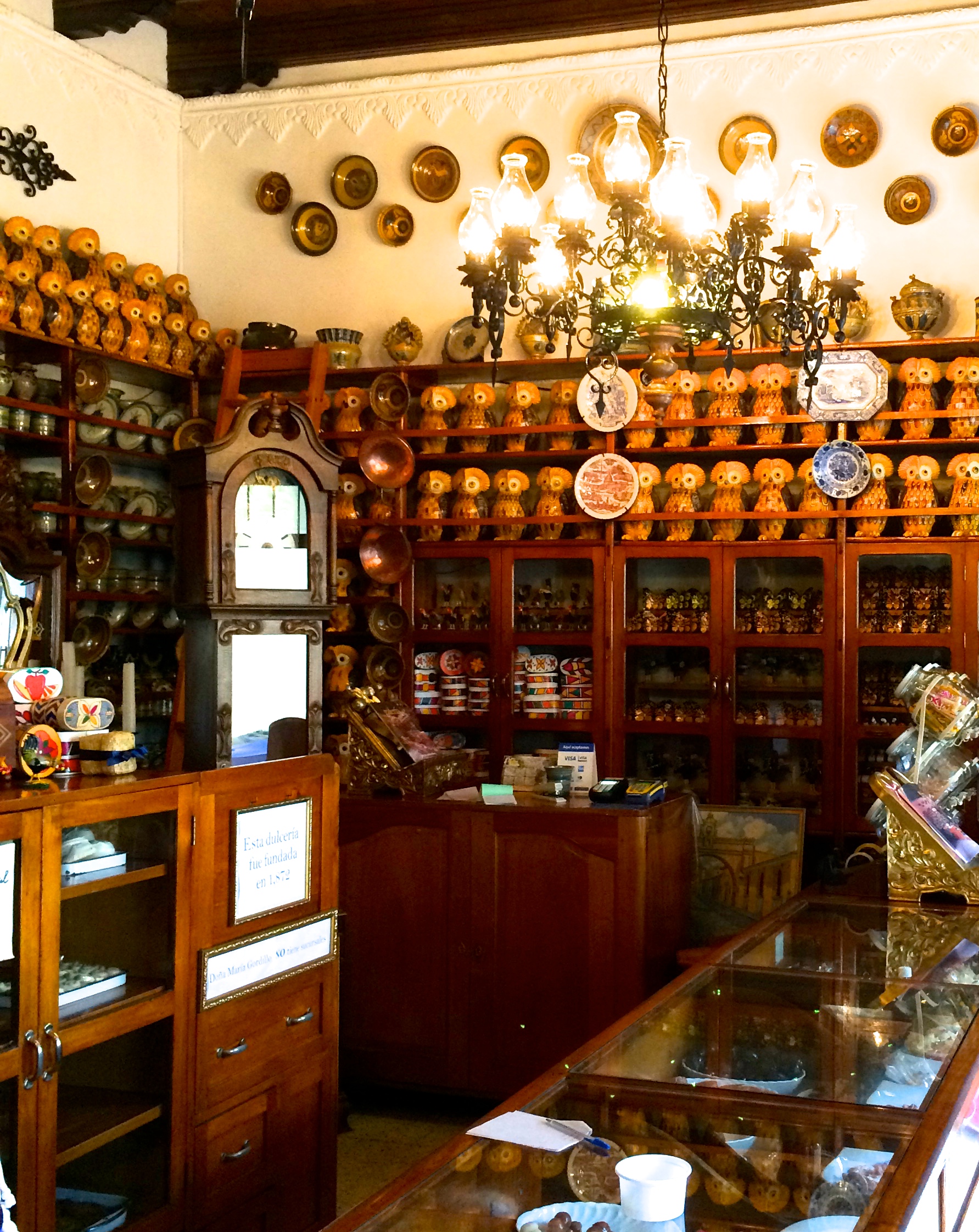 Adorable 100-year-old candy shop (those "lucky owl" piggy banks are EVERYWHERE in Antigua, btw).