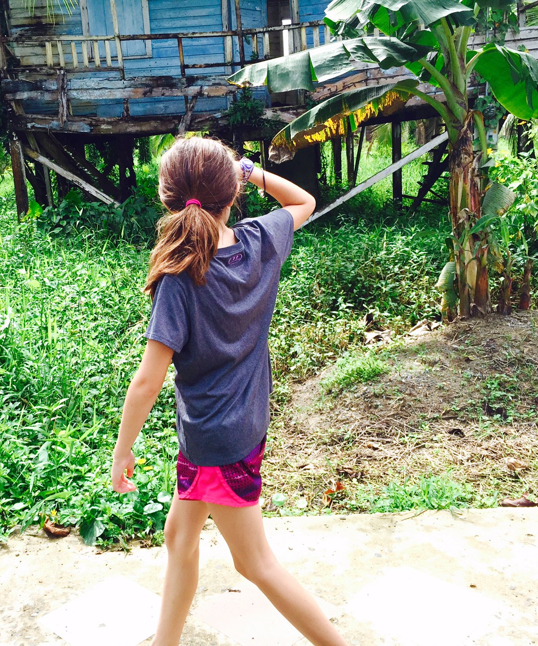 Me looking at an abandoned house on the road walking from the boat into Bocas Town.