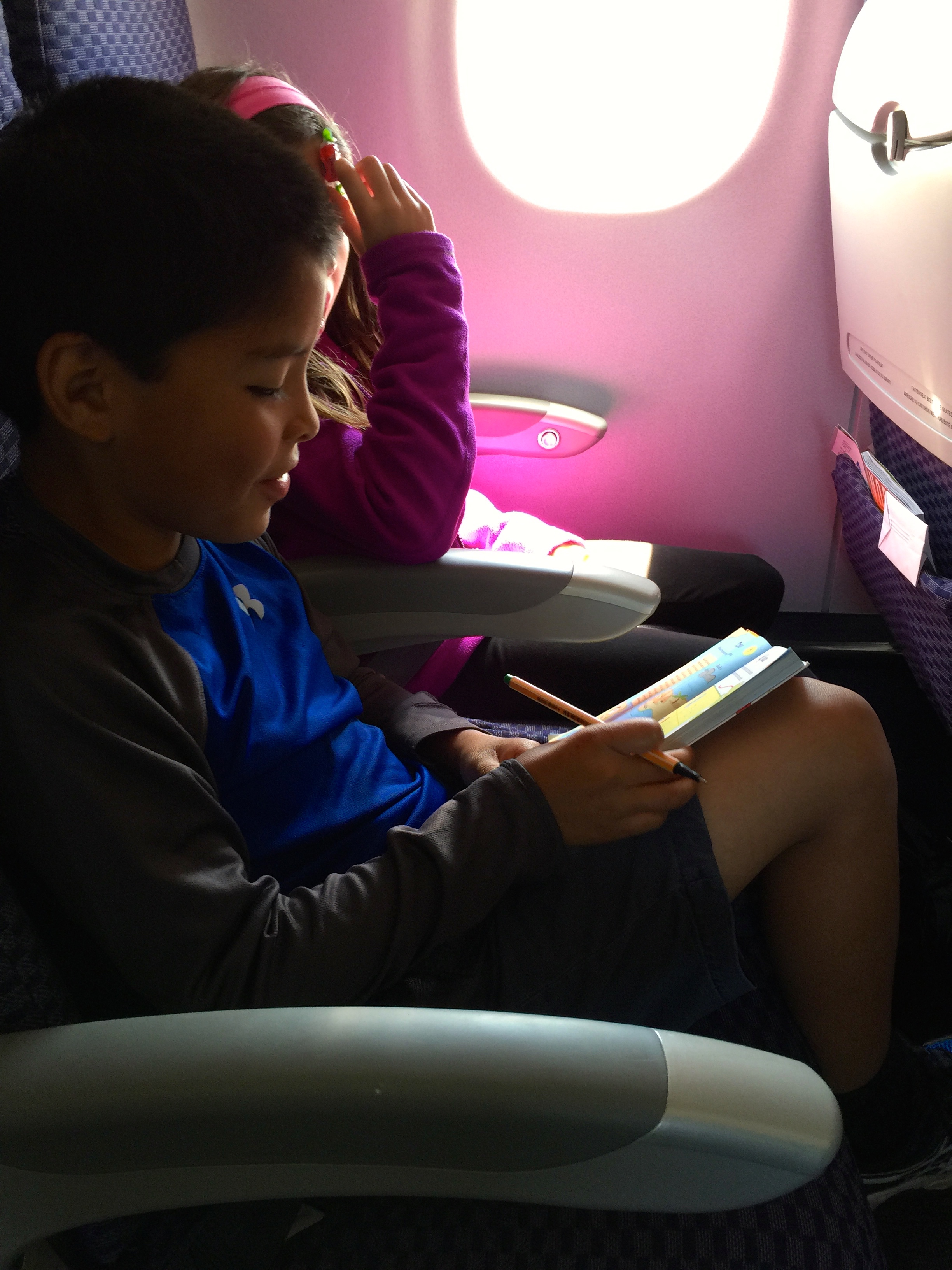 Using the "travel games" book from Auntie Boo on the plane.