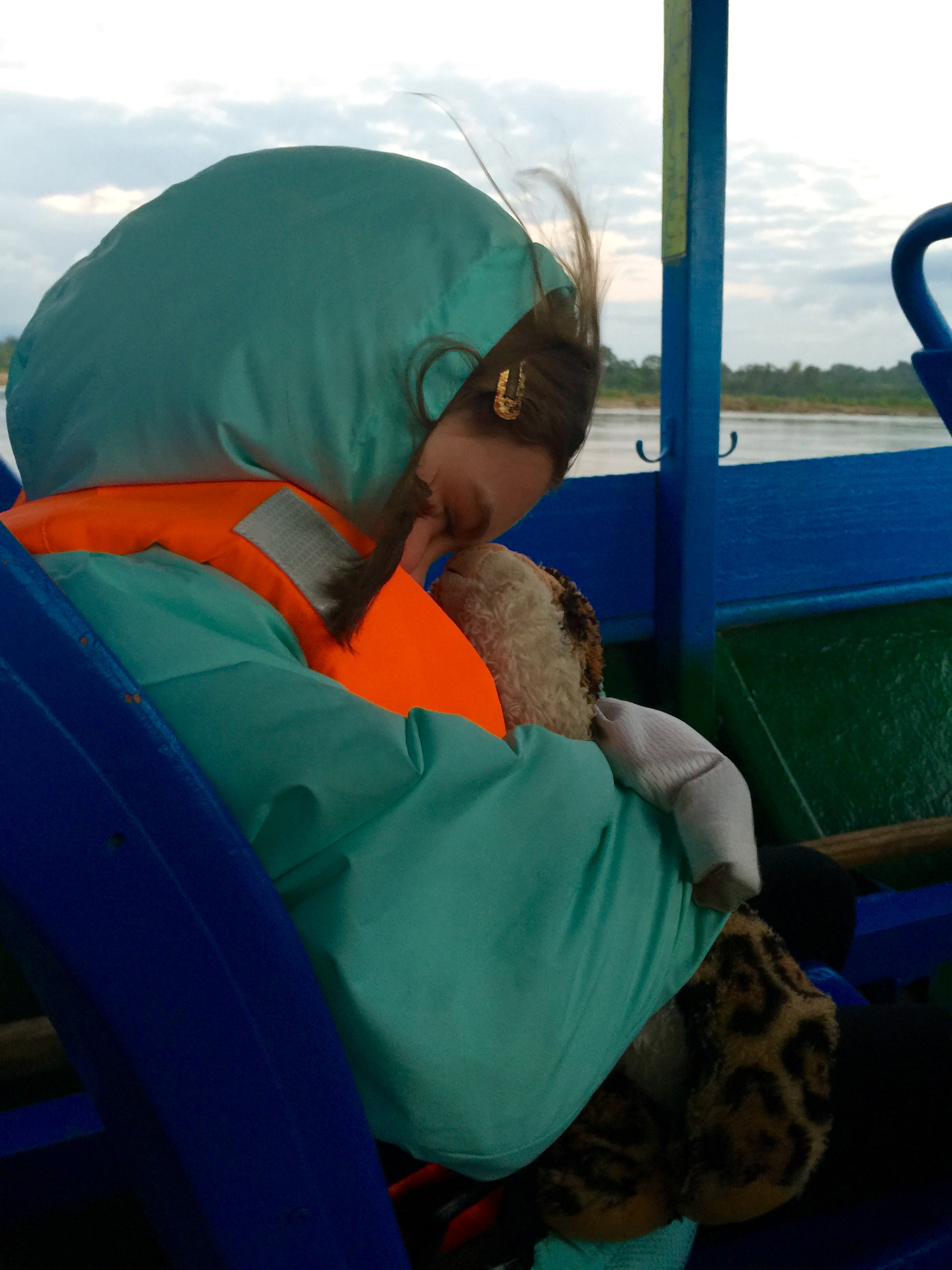 Liadan trying to sleep on the boat at dawn