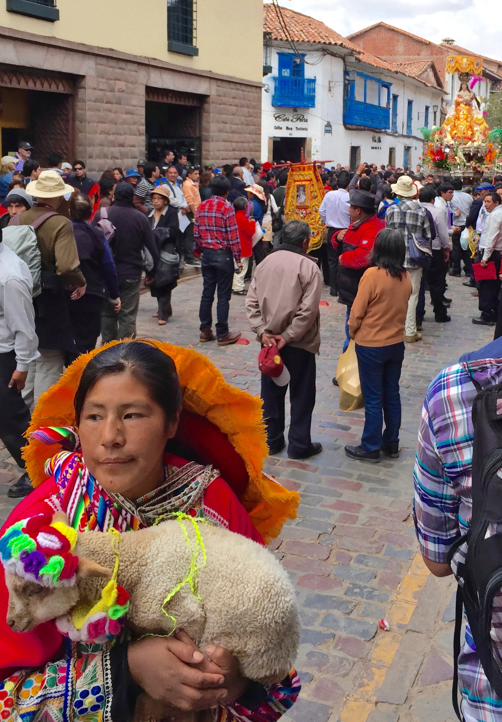 Saint statues...bands...women with baby llamas. Yeah, that's Cuxco.